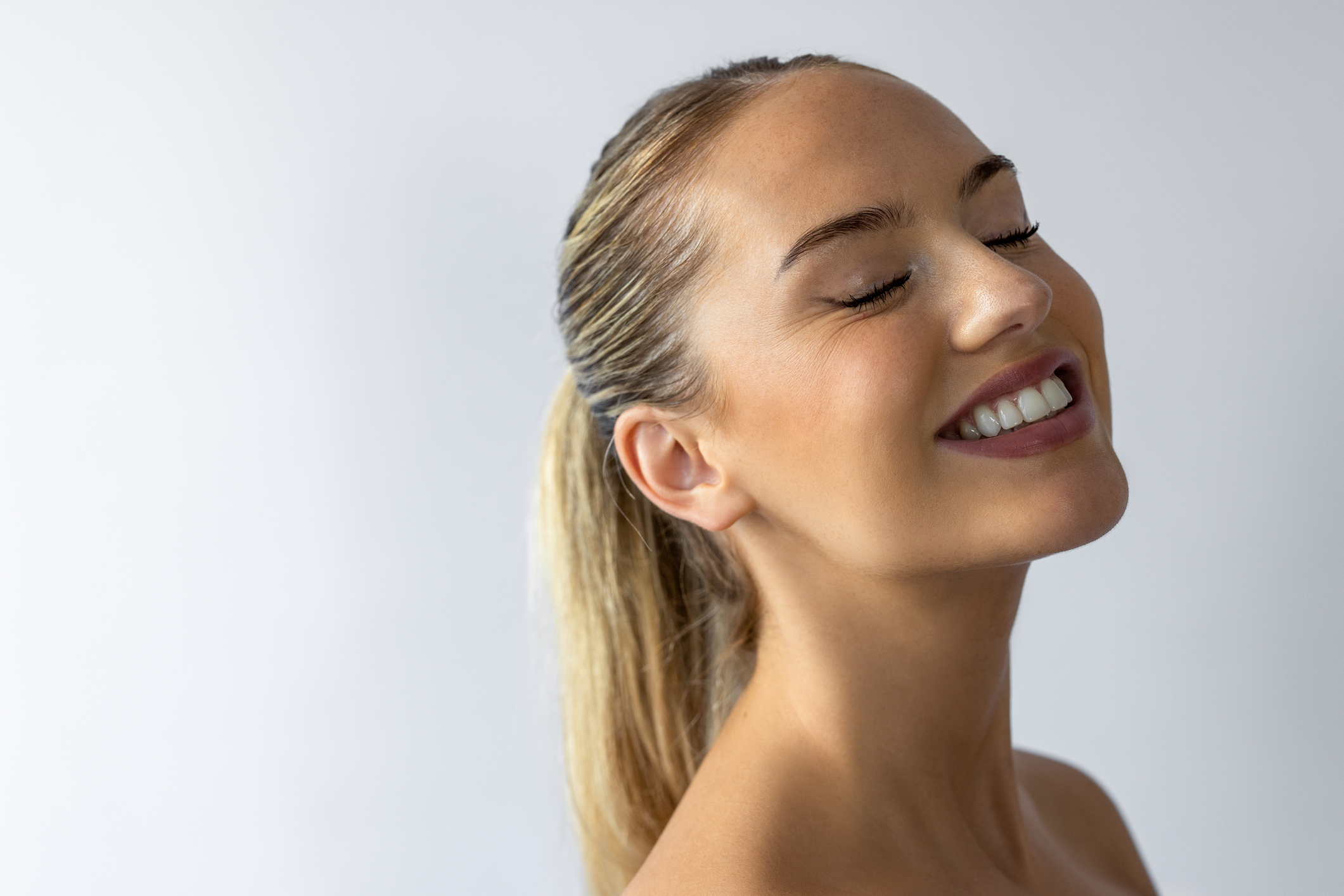 Pretty woman eyes closed and smiling Pretty woman eyes closed and smiling